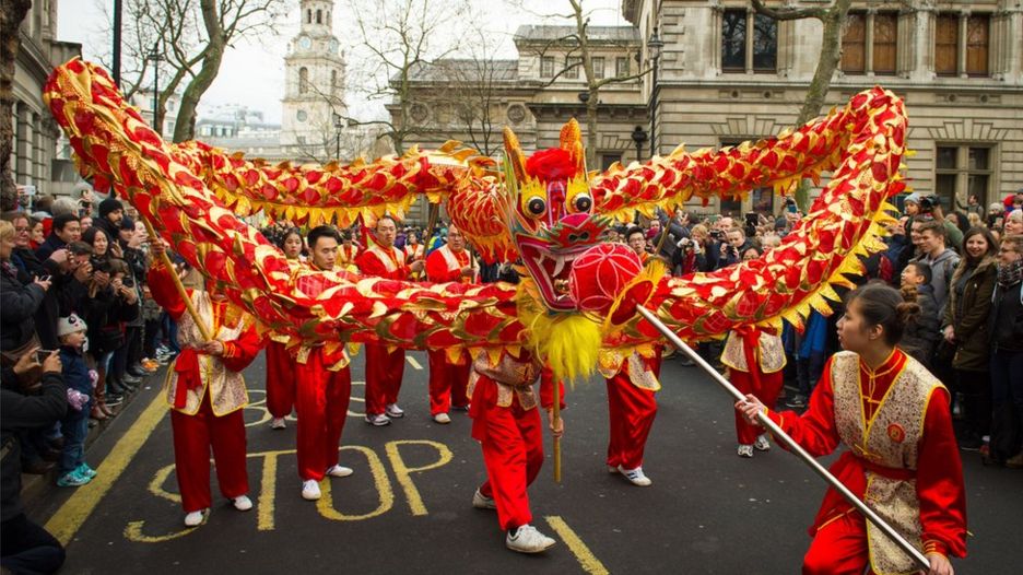 Dancers perform a traditional dragon dance during the Chinese New Year parade in London