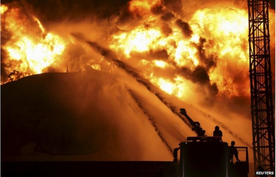 Firefighters try to extinguish a fire at a petrochemical plant in Zhangzhou, Fujian province 7 April 2015