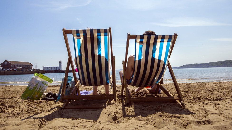 People enjoy the hot weather on the beach in Scarborough, North Yorkshire