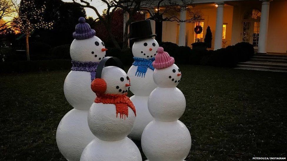 snowmen in the rose garden