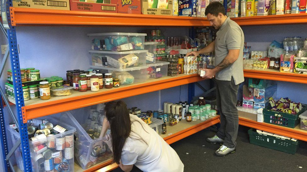 Laura and Tom organising the food bank