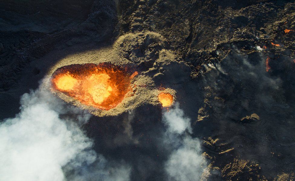 An impressive aerial view above an erupting volcano on Reunion Island