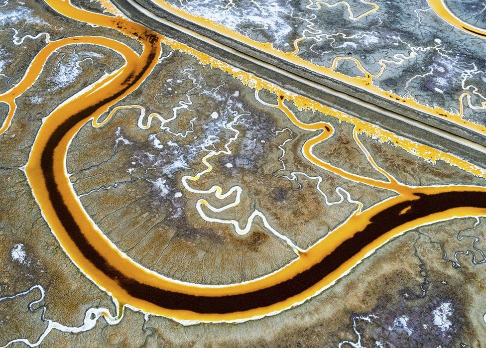 An aerial view of the bright colours of San Francisco salt mines