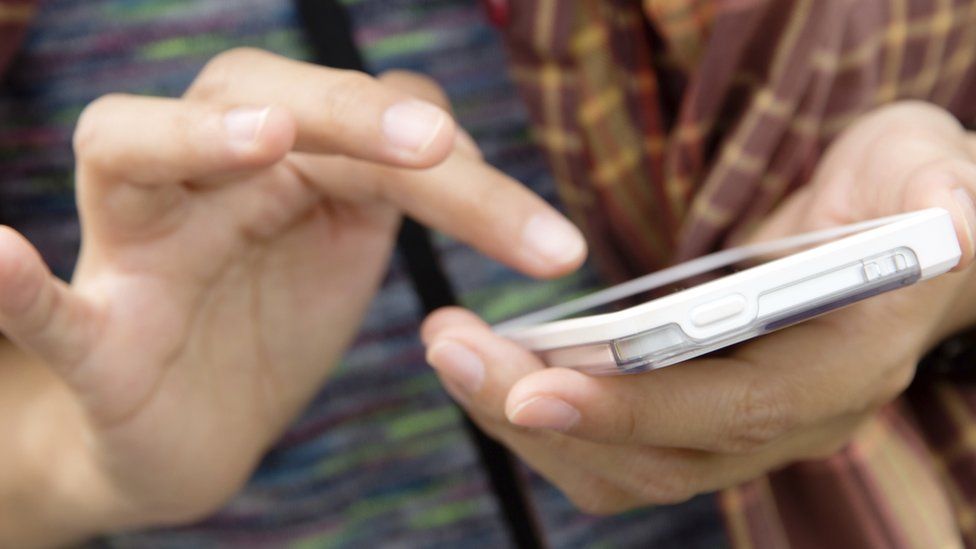 A woman using her phone