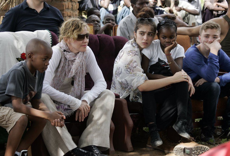 Madonna with her children (L to R) David Banda, Lourdes, Mercy James, and Rocco on a charity visit to Malawi