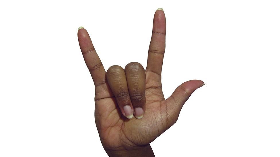 What Does Horns Down Gesture Mean