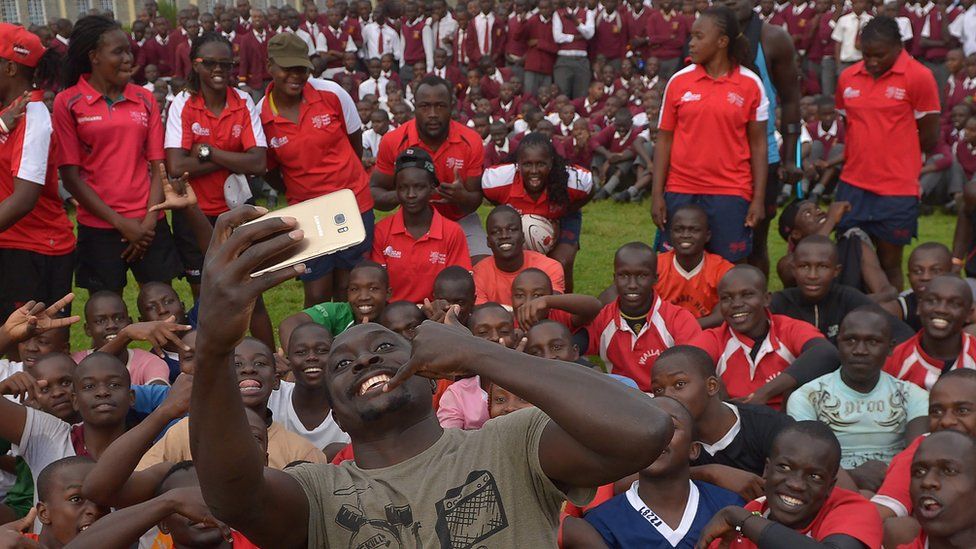 Kenya's Collins Injera poses for a selfie during a clinic held for high-school rugby players at the training camp for the Kenyan rugby sevens team (the Shujaas) for the Rio Olympics at Nandi county near Eldoret. Monday 18 July 2016