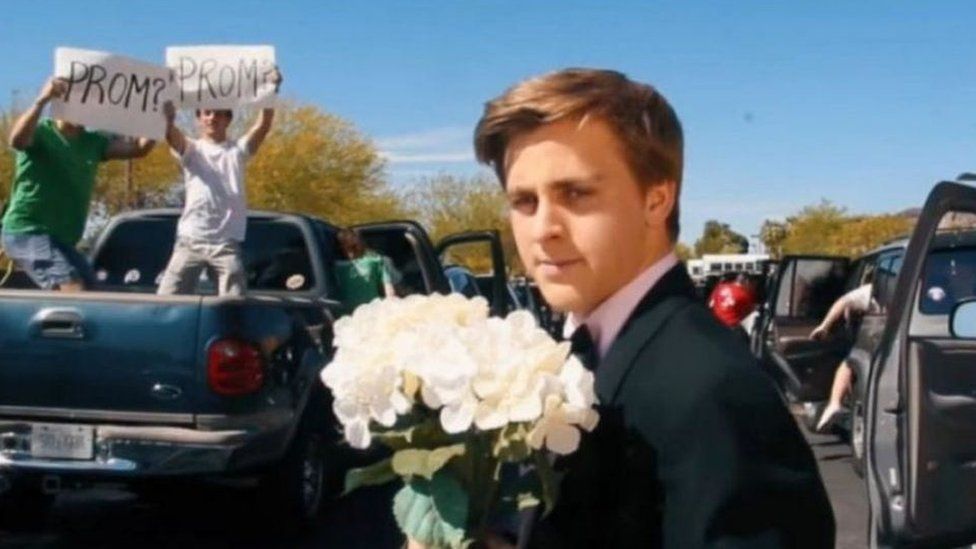 Jacob Staudenmaier holding flowers in the video