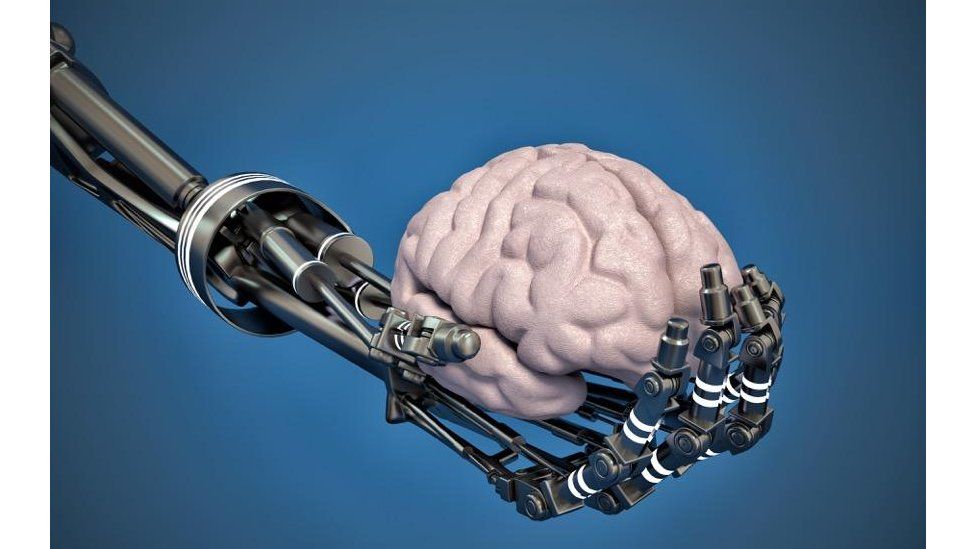 Robot hand holding brain