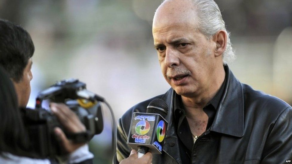 Carlos Chavez, the president of Bolivia's Football Federation, speaks to a reporter