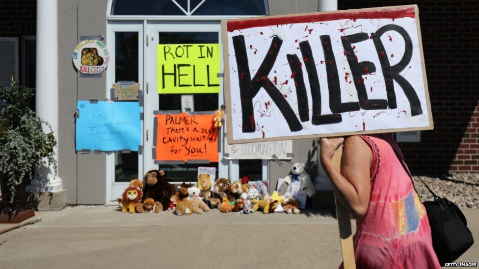 Protesters outside the dental practice run by Walter Palmer in Minnesota, the American accused of killing Cecil the lion in Zimbabwe - 29 July 2015