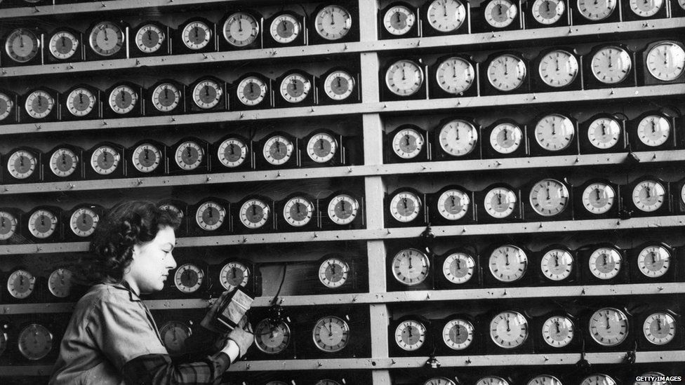 A black and white picture of lots of clocks in the 1940s