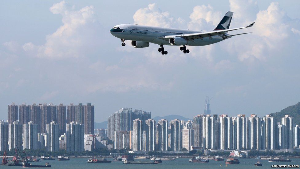 In this picture taken on August 10, 2014, a Cathay Pacific passenger plane prepares to land at Hong Kong's international airport.