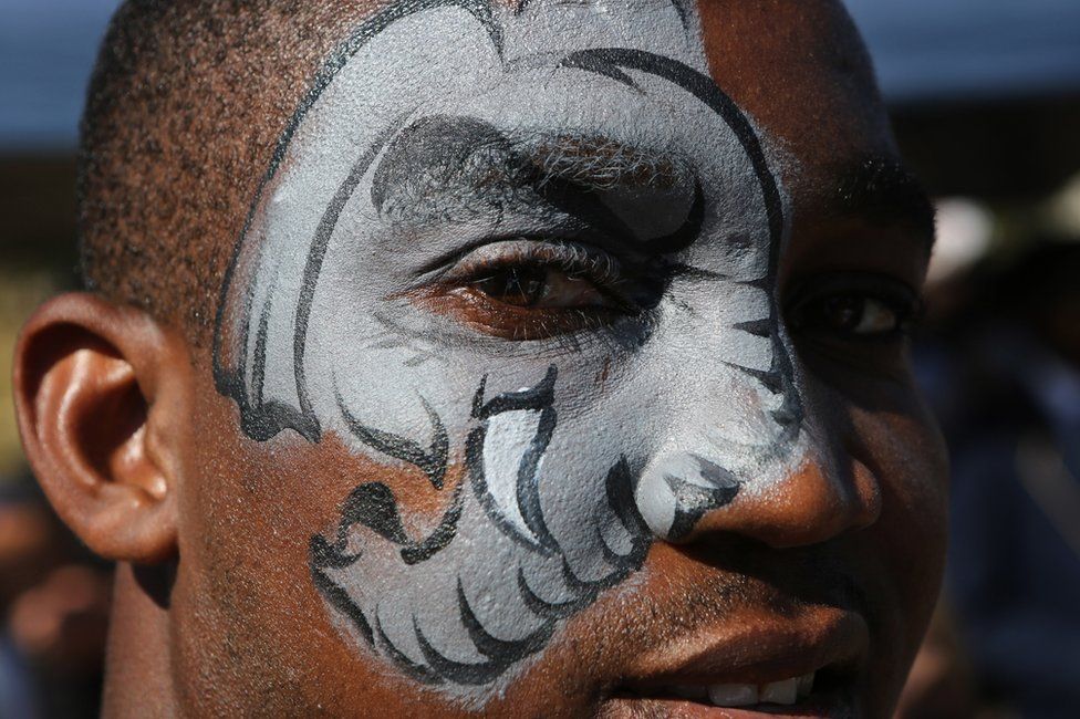 An activist with an elephant motive made up on his face, marches to the site of the Cites meeting in Sandton, Johannesburg, South Africa - Saturday 24 September 2016