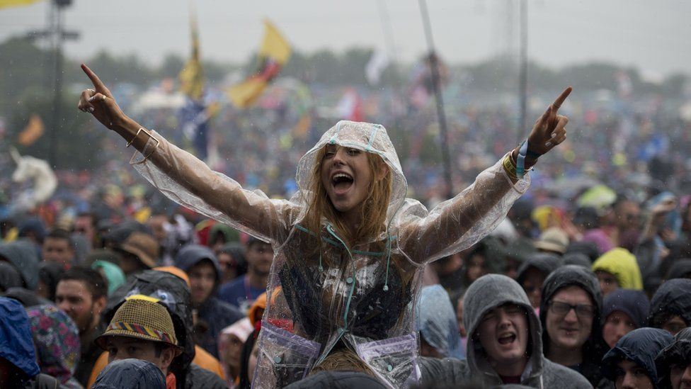 Woman in the crowd at Glastonbury