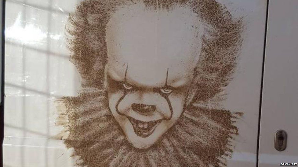 Pennywise in mud on the back of a van