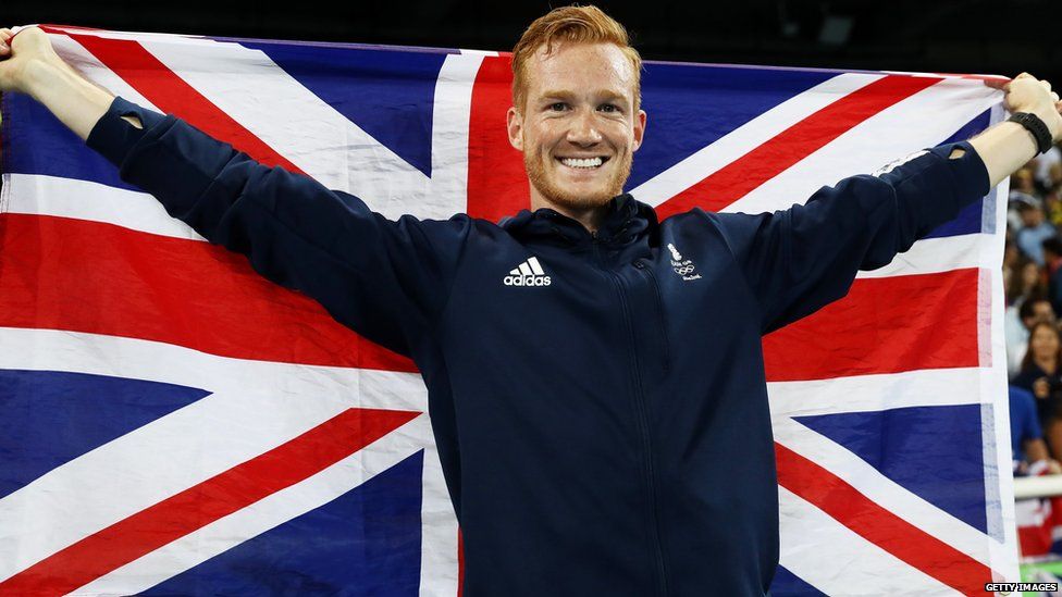 Greg Rutherford holding the Union Jack