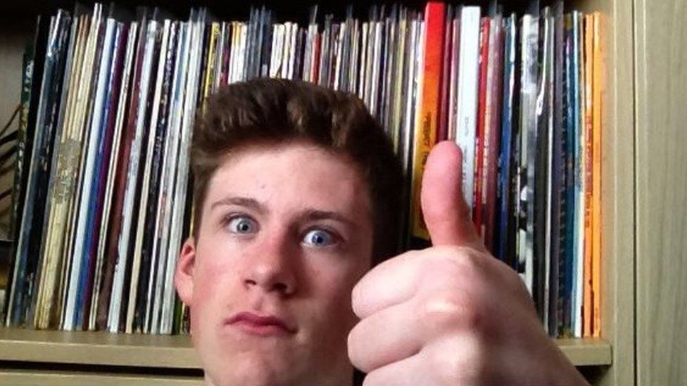 Ben gives a thumbs up with his records