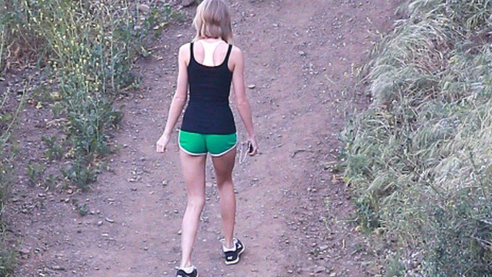 girl walking backwards