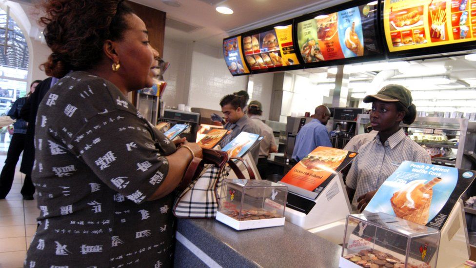 Women being served in a fast food restaurant