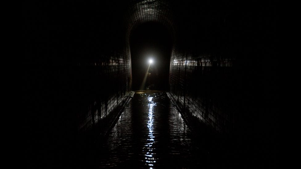 A Thames Water employee conducts and inspection of the Fleet River sewer tunnel