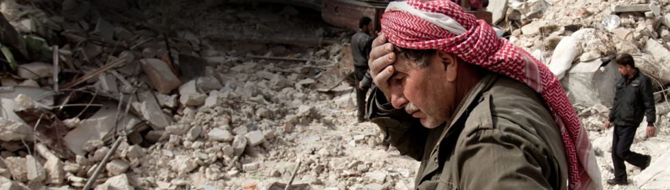 Grieving Syrian man