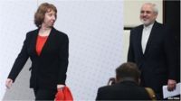 Catherine Ashton and Iranian Foreign Minister Mohammad Javad Zarif arrive for a press statement after a conference in Vienna on 20 February 2014.
