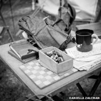 A table with gloves and chess pieces