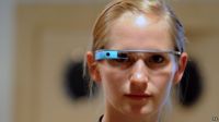 A woman wearing a Google Glass computer