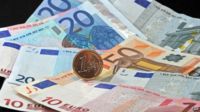 Euro notes and one euro coin