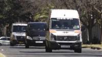 The ambulance carrying Nelson Mandela arriving at his home