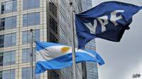 Banderas de Argentina y de YPF