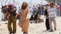 Gente huyendo de Mosul