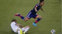 Kostas Katsouranis y Makoto Hasebe