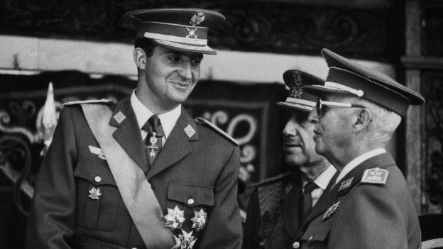 Juan Carlos I y Francisco Franco