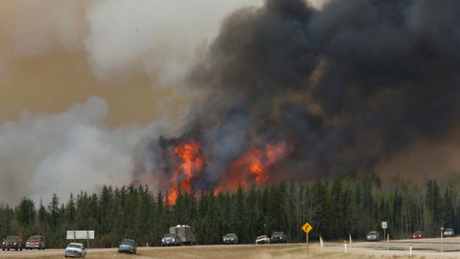 160506223448__wildfire_burns_as_evacuees_who_were_stranded_north_of_fort_mcmurray_alberta_canada_640x360_reuters_nocredit.jpg