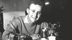 Alex Young with his Hearts trophies