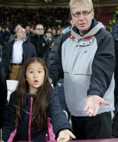 Chelsea fans Paul Streeter and daughter Victoria with the coins they say were thrown during the disorder