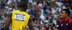 Usain Bolt greets a volunteer