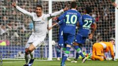 Real Madrid forward Cristiano Ronaldo celebrates scoring against Wolfsburg in the Champions League