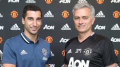 Henrikh Mkhitaryan and Jose Mourinho
