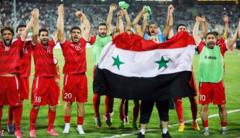 Syrian players celebrate reaching the play-off