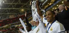 Ashley Williams lifts the League Cup in 2013