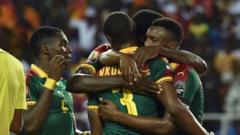 Cameroon players celebrate Nicolas Nkoulou's goal