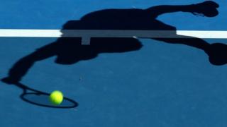 Silhouette of a tennis player