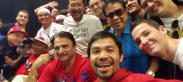 A relaxed Pacquiao takes a selfie before the weigh-in
