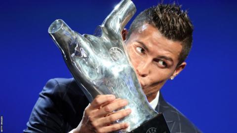 Cristiano Ronaldo was named Uefa Best Player in Europe for a second time - and celebrated by kissing the trophy