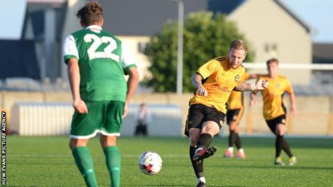 Ben Swallow takes a shot for Newport against Barry Town Utd