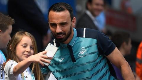 Leon Britton and a young fan