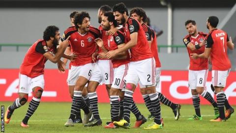 Mohamed Salah is surrounded by team-mates after scoring
